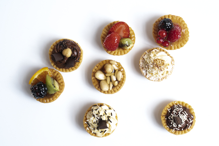 some mixed round pastries on a white surfaceの写真素材