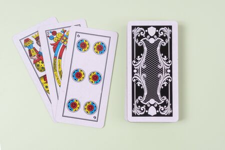 front and rear of  Cards for the briscola game on a white table