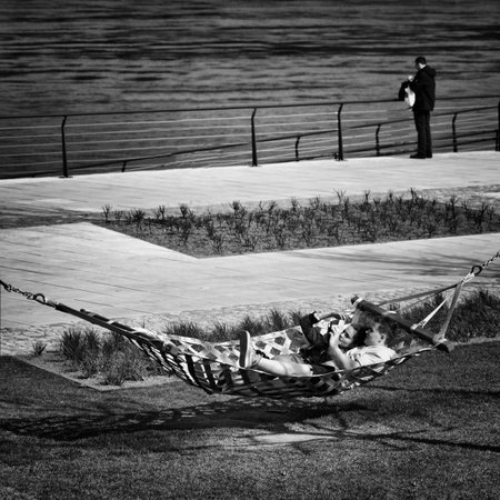 warsaw, Poland. May, 2019. a couple lying on a hammock on the bank of the Vistula Riverのeditorial素材