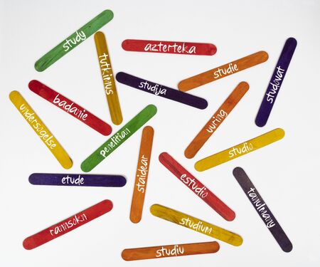 the concept of the word study in various languages on wooden coloured slatsの写真素材