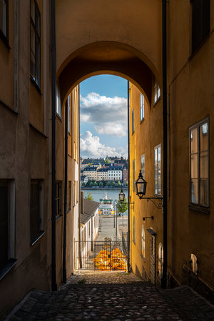 Stockholm, Sweden. September 2019.  view of the bay through a narrow alleyway between the old houses of Gamla Stan islandのeditorial素材