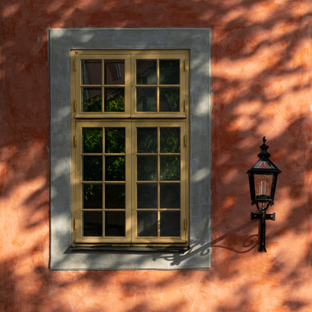 Stockholm, Sweden. September 2019.  an old window in the shade of a tree on Gamla Stan islandのeditorial素材