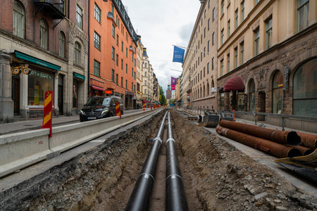 Stockholm, Sweden. September 2019.  excavations for laying pipes in a city center streetのeditorial素材