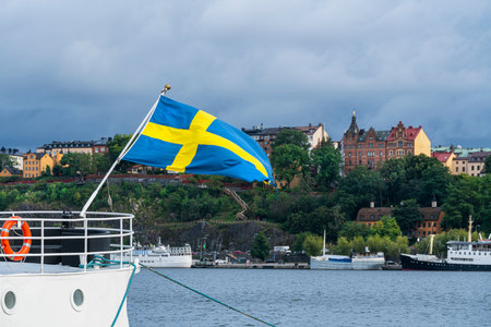 Stockholm, Sweden. September 2019. the Swedish flag waving on a boatのeditorial素材