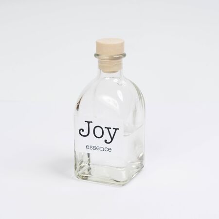 a glass bottle containing Joy essenceの写真素材