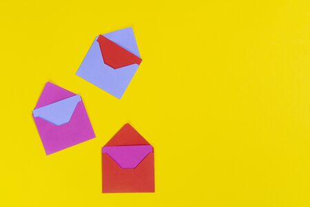 Some greeting cards with  various colors on a colored surfaceの写真素材