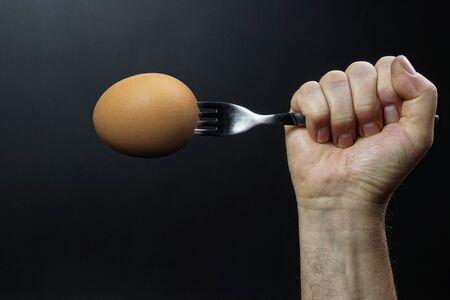 an egg impaled on a fork