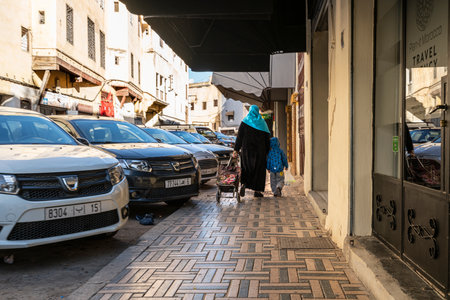Fez, Morocco. November 9, 2019.  a woman with her child in a city center streetのeditorial素材