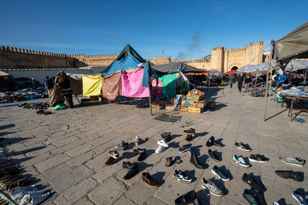 Fez, Morocco. November 9, 2019.  the stands of clothing vendors in the large Place Boujloudのeditorial素材