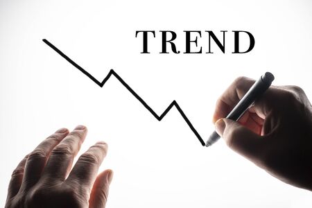 the trend graph drawn on a backlit surfaceの写真素材