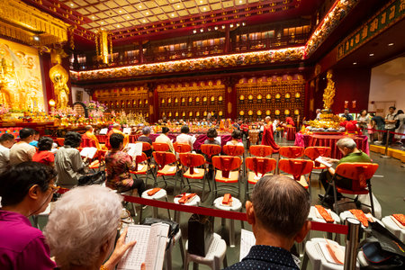 Singapore. January 2020.  The faithful pray in Buddha Tooth Relic Temple