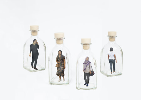 women locked in glass bottles in isolation from the Covid 19 pandemicのeditorial素材