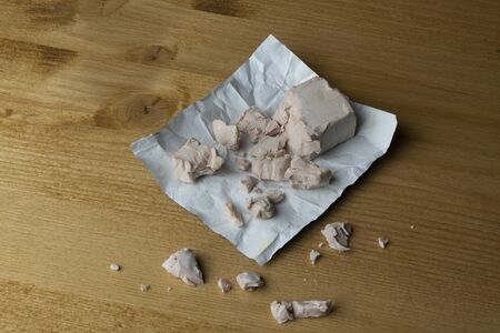 a cube of brewer's yeast crumbled on the table