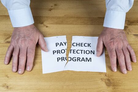 a man gives up on the  paycheck protection programの写真素材