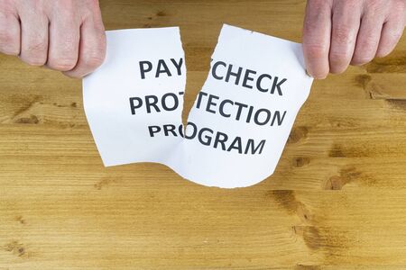 a man gives up on the  paycheck protection programの写真素材