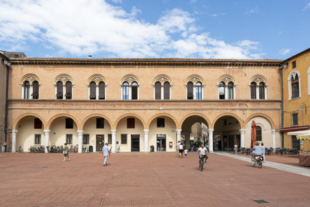 Ferrara, Italy. August 6, 2020. the clock tower in the cathedral square in ferrara, italy