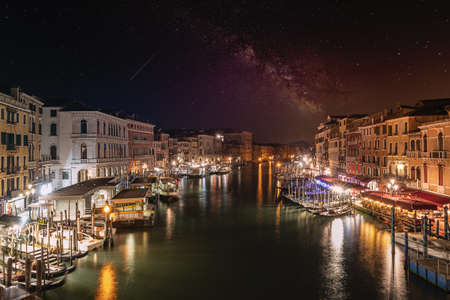 Venice, Italy. October 8, 2020. the light of a street lamp illuminates the pavement of a street in the city centerの写真素材