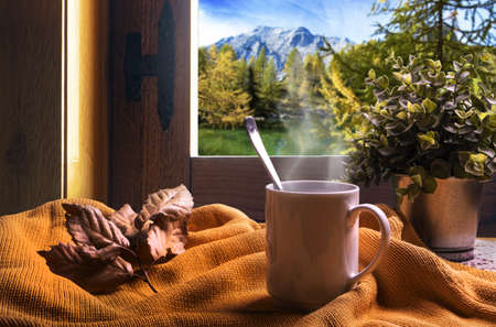 Take an hot tea cup in autumn