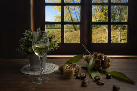 the table set for breakfast on a wooden table in autumnの写真素材