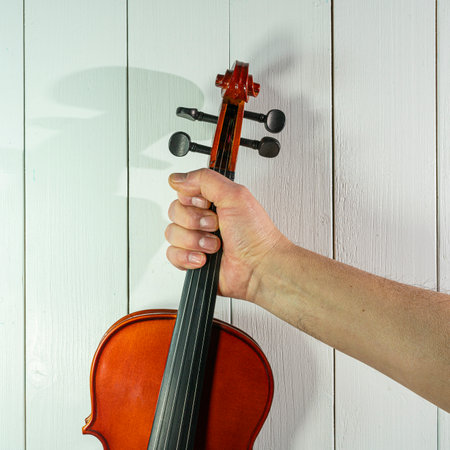 a violin on wooden tableの写真素材