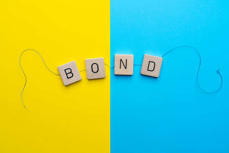 the word Bond formed with the letters linked together by a threadの写真素材
