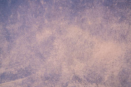 the plaster of a pink colored wall as a background