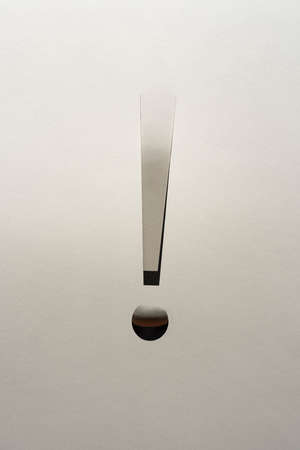 An exclamation point made by cutting a cardboardの写真素材