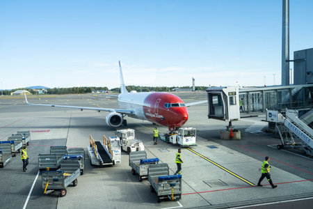 Oslo, Norway. September 2021. ground attendant at work in the aircraft parking area at Oslo-Gardermoen airportのeditorial素材