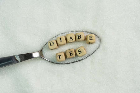 the word Diabetes inside a spoon full of sugarの写真素材