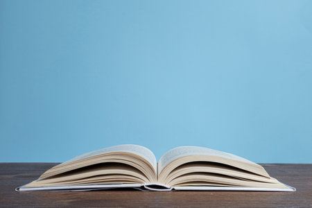 an open book on a wooden table