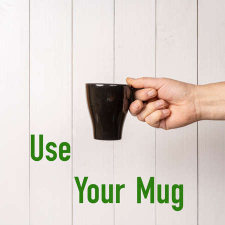 a cup of coffee and an invitation to use reusable cups
