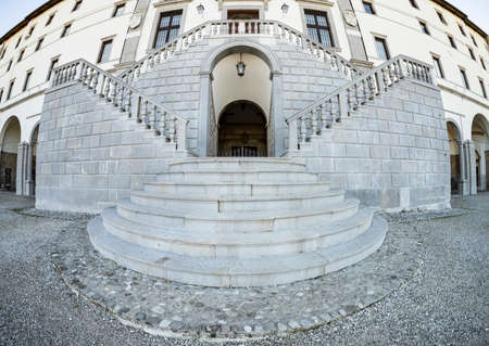 Udine, Italy. January 2022. panoramic view of the staircase in front of the city castle buildingの写真素材
