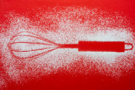 the imprint of the kitchen whisk on a colored surface
