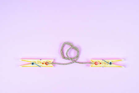 the connection with a string between two clothespins
