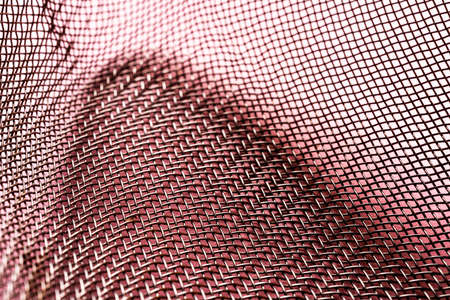 detail of the wire mesh of a colander in the kitchenの写真素材