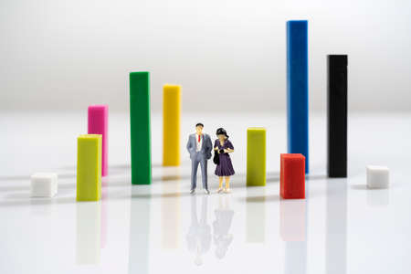 a pair of miniature models among some colored parallelepipeds