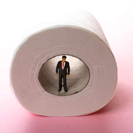 a figurine inside a roll of toilet paperの写真素材