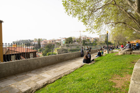 Porto, Portugal. March 2022. people relax admiring the panorama of the city on the Virtudes parkのeditorial素材