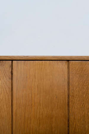 a white wall lined with wooden planksの写真素材