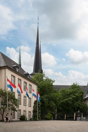 Luxembourg city, May 2022. the flags of Luxembourg flying in a square in the city centerのeditorial素材