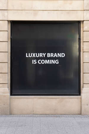 Luxembourg city, May 2022. the sign indicating Luxury brand coming soon on a shop window in the city centerのeditorial素材