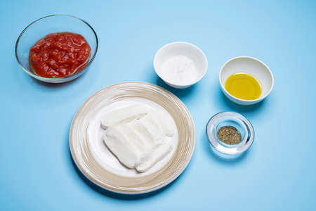 the ingredients for the preparation of pizza margherita on the tableの写真素材