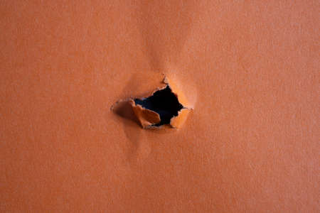 a red card with a hole in the center