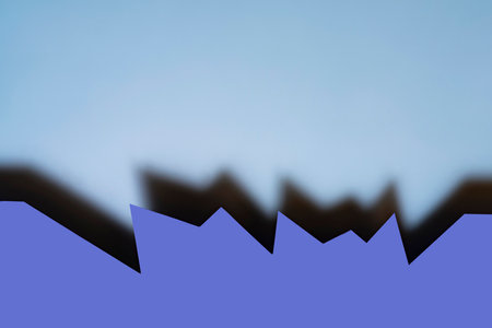 a blue background formed with the shadow of a cut cardの写真素材