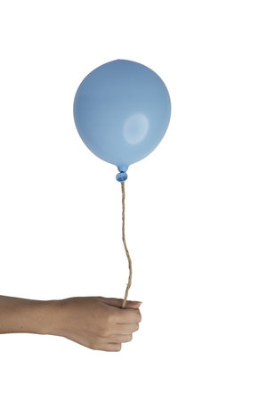a blue balloon in the female hand on a transparent backgroundの写真素材