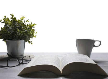 an open book on a wooden surface and a transparent background