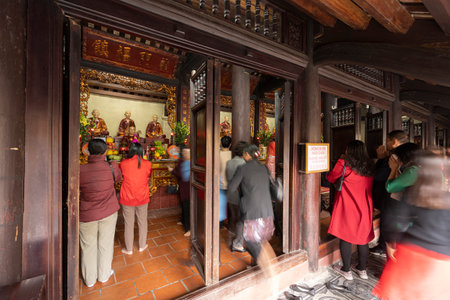Hanoi, Vietnam, January 2023. the faithful within the Tran Quoc Pagoda, the oldest Buddhist temple in Hanoi, is located on a small island near the southeastern shore of Hanoi's West Lake.のeditorial素材
