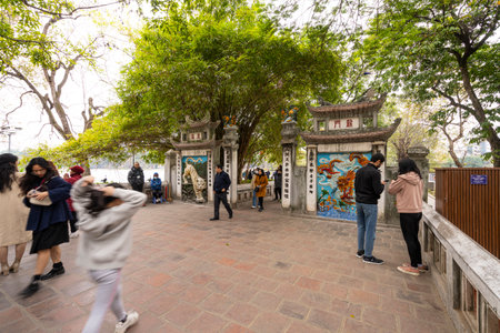 Hanoi, Vietnam, January 2023. view of Ngoc Son Temple, Confucian temple on the Hoan Kiem lake crossed by a bridge, with tower and pavilions dedicated to the national hero.のeditorial素材