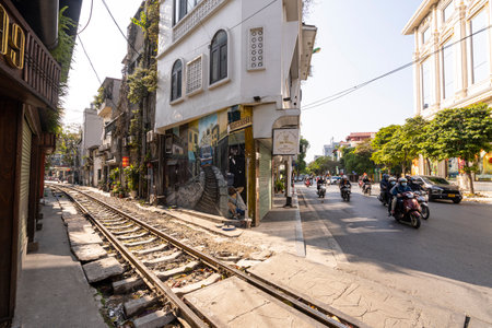 Hanoi, Vietnam, January 2023. the passage of a train along the tracks between the houses of the old district of the city centerのeditorial素材