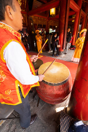 Hanoi, Vietnam, January 2023. the grand ceremony with women in traditional costumes during the new year celebration of the temple of literatureのeditorial素材